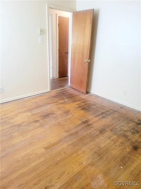 422 Walnut St, Petersburg, VA 23803 - spare room featuring wood finished floors and baseboards