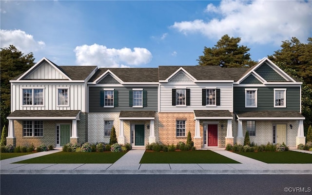 6013 Banyan Ln, Chesterfield, VA 23234 - townhome / multi-family property with brick siding, a front yard, and board and batten siding