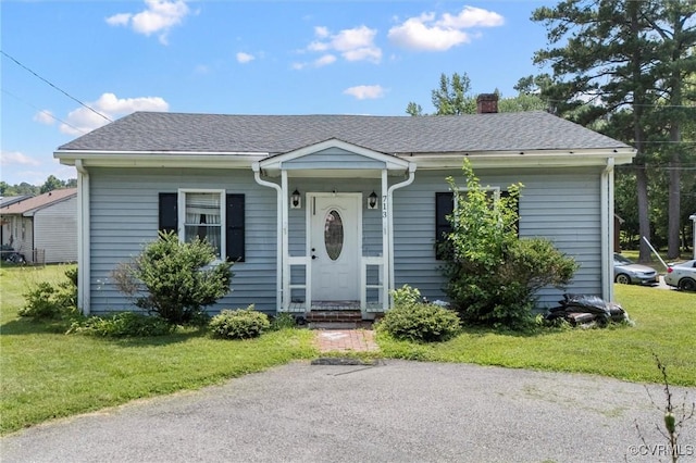 713 Lakeview Ave, Colonial Heights, VA 23834 - bungalow-style home featuring a chimney, a front lawn, and a shingled roof