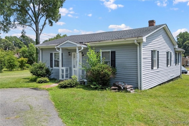 713 Lakeview Ave, Colonial Heights, VA 23834 - view of front of property featuring a chimney, a front yard, and roof with shingles
