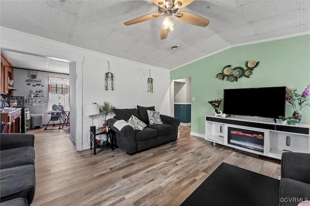 713 Lakeview Ave, Colonial Heights, VA 23834 - living room with wood finished floors, crown molding, ceiling fan, and lofted ceiling