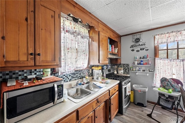 713 Lakeview Ave, Colonial Heights, VA 23834 - kitchen with appliances with stainless steel finishes, brown cabinets, and light countertops