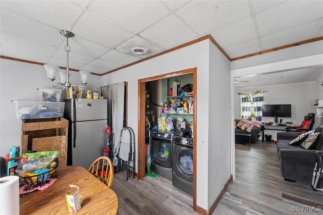 713 Lakeview Ave, Colonial Heights, VA 23834 - dining area with washing machine and clothes dryer, crown molding, wood finished floors, and a drop ceiling
