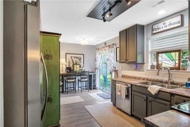 4115 Stonewood Ln, Williamsburg, VA 23188 - kitchen featuring stainless steel appliances, backsplash, and wood finished floors
