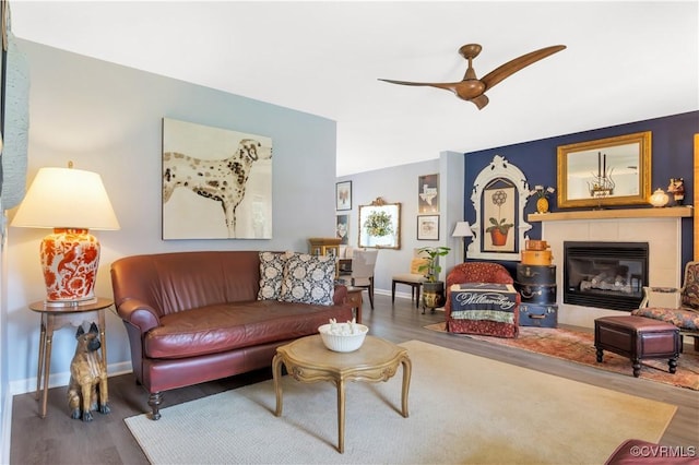 4115 Stonewood Ln, Williamsburg, VA 23188 - living room featuring wood finished floors, a glass covered fireplace, and ceiling fan