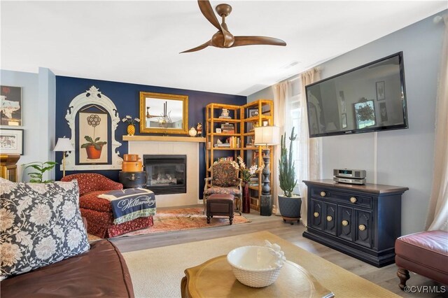 4115 Stonewood Ln, Williamsburg, VA 23188 - living area with a fireplace, ceiling fan, and wood finished floors