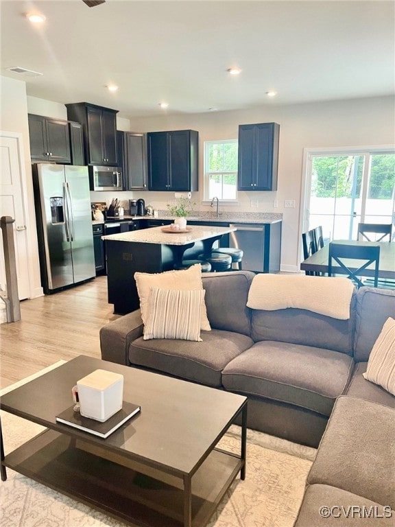 10904 Genito Square Dr, Chesterfield, VA 23112 - living room featuring light wood-style floors and recessed lighting