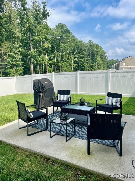 10904 Genito Square Dr, Chesterfield, VA 23112 - fenced backyard with a patio, outdoor lounge area, and a grill