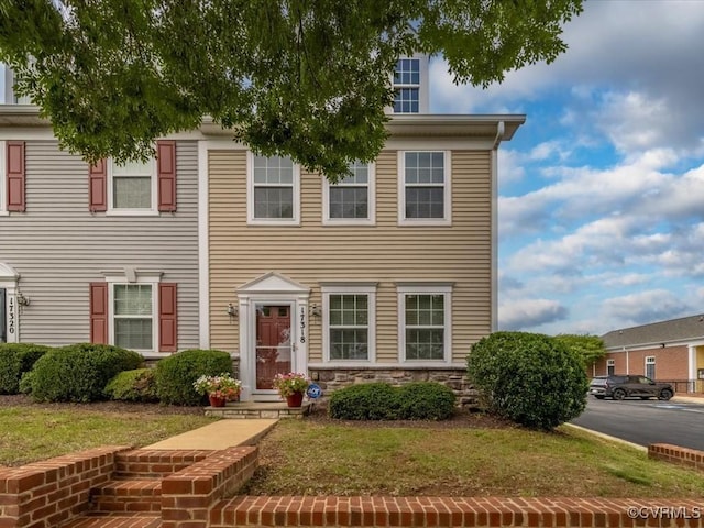 17318 Library Blvd, Ruther Glen, VA 22546 - view of front of property with a front lawn and stone siding