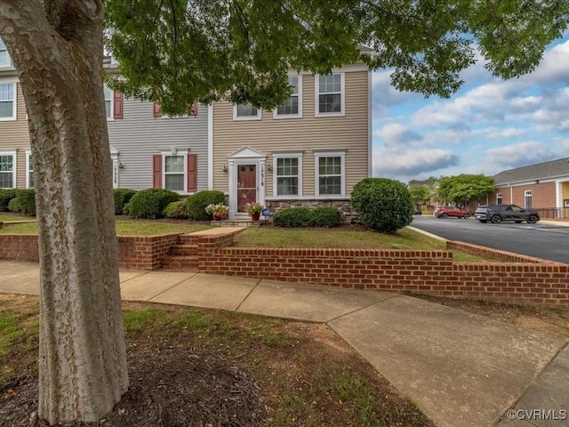17318 Library Blvd, Ruther Glen, VA 22546 - view of front facade with stone siding and uncovered parking