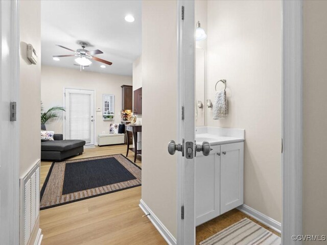 17318 Library Blvd, Ruther Glen, VA 22546 - bathroom featuring vanity, a ceiling fan, wood finished floors, and recessed lighting