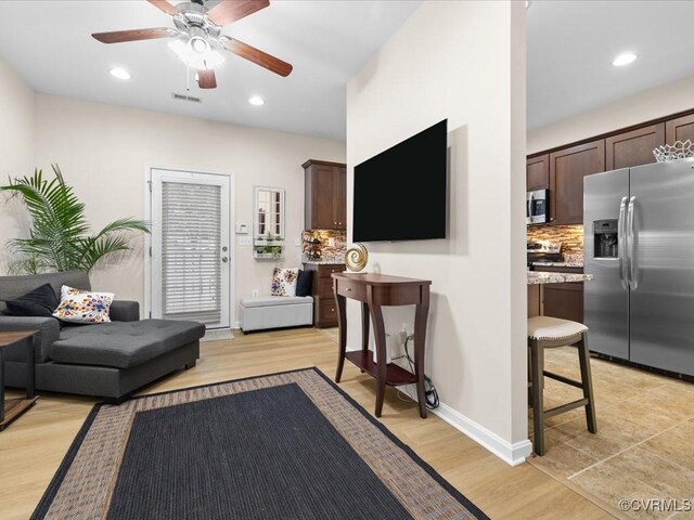 17318 Library Blvd, Ruther Glen, VA 22546 - living area featuring a ceiling fan, recessed lighting, and light wood finished floors