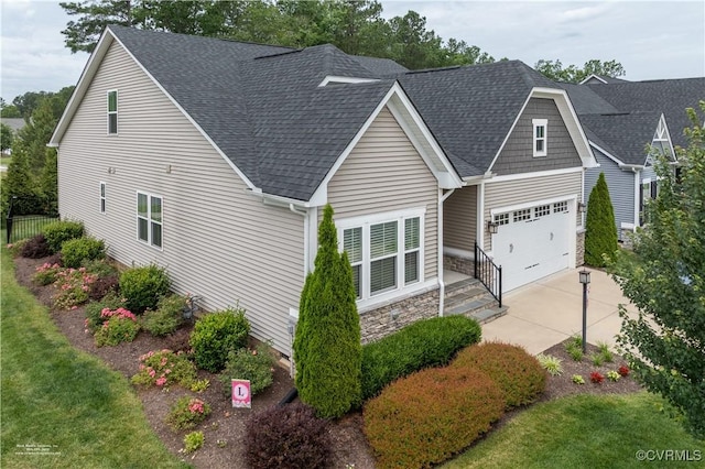 6448 Twin Falls Ter, Moseley, VA 23120 - view of front of home featuring concrete driveway, stone siding, and a shingled roof