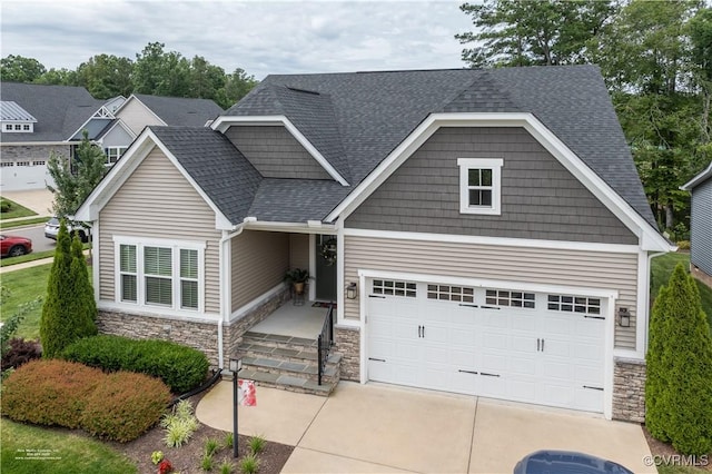 6448 Twin Falls Ter, Moseley, VA 23120 - craftsman house with stone siding, a shingled roof, and driveway