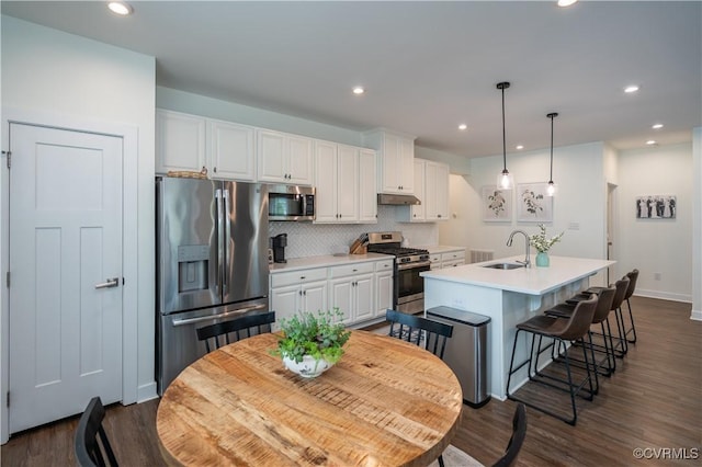 6448 Twin Falls Ter, Moseley, VA 23120 - kitchen featuring appliances with stainless steel finishes, white cabinets, decorative backsplash, light countertops, and recessed lighting