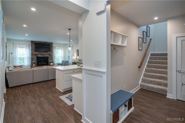 6448 Twin Falls Ter, Moseley, VA 23120 - kitchen featuring dark wood-style flooring, light countertops, a fireplace, recessed lighting, and decorative light fixtures