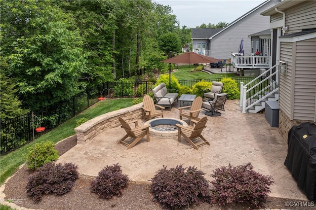 6448 Twin Falls Ter, Moseley, VA 23120 - fenced backyard with an outdoor fire pit, a patio, and stairs