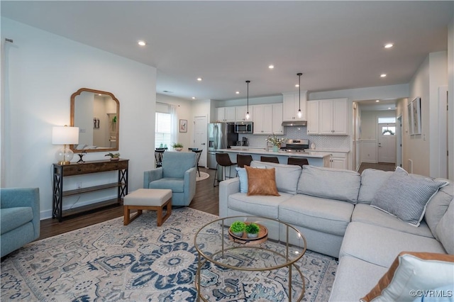 6448 Twin Falls Ter, Moseley, VA 23120 - living room featuring wood finished floors and recessed lighting