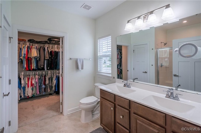 6448 Twin Falls Ter, Moseley, VA 23120 - bathroom with a spacious closet, a stall shower, double vanity, and tile patterned floors