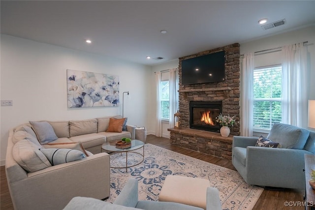 6448 Twin Falls Ter, Moseley, VA 23120 - living area with wood finished floors, a stone fireplace, and recessed lighting