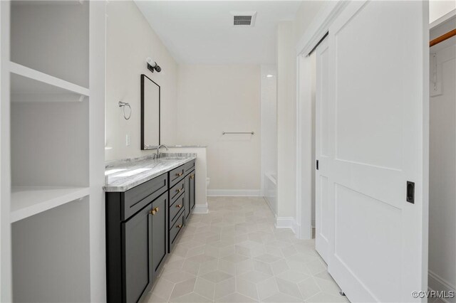 4705 Fitzhugh Ave, Richmond, VA 23230 - bathroom with double vanity and tile patterned flooring