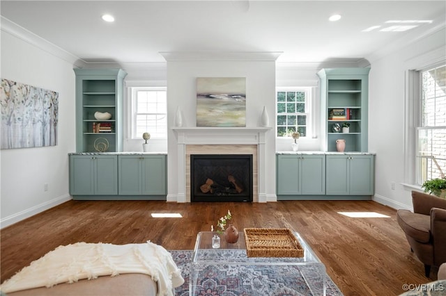 4705 Fitzhugh Ave, Richmond, VA 23230 - living area featuring crown molding, a glass covered fireplace, healthy amount of natural light, wood finished floors, and recessed lighting
