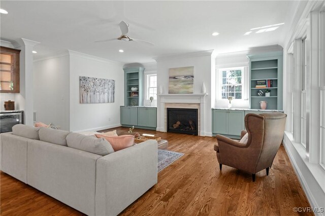 4705 Fitzhugh Ave, Richmond, VA 23230 - living room with a fireplace, ornamental molding, wood finished floors, ceiling fan, and recessed lighting