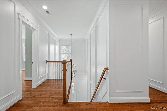 4705 Fitzhugh Ave, Richmond, VA 23230 - hallway with an upstairs landing, a decorative wall, and wood finished floors