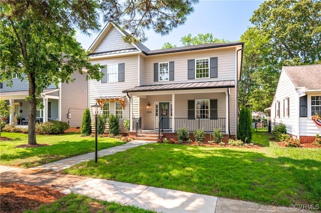 4705 Fitzhugh Ave, Richmond, VA 23230 - view of front of home with a standing seam roof, a porch, a front yard, and a metal roof