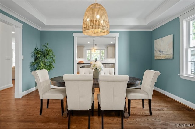 4705 Fitzhugh Ave, Richmond, VA 23230 - dining area with wood finished floors, ornamental molding, and a raised ceiling