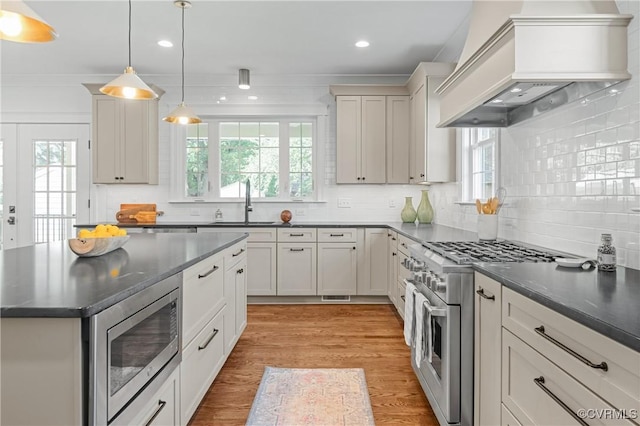4705 Fitzhugh Ave, Richmond, VA 23230 - kitchen with appliances with stainless steel finishes, custom range hood, plenty of natural light, recessed lighting, and crown molding