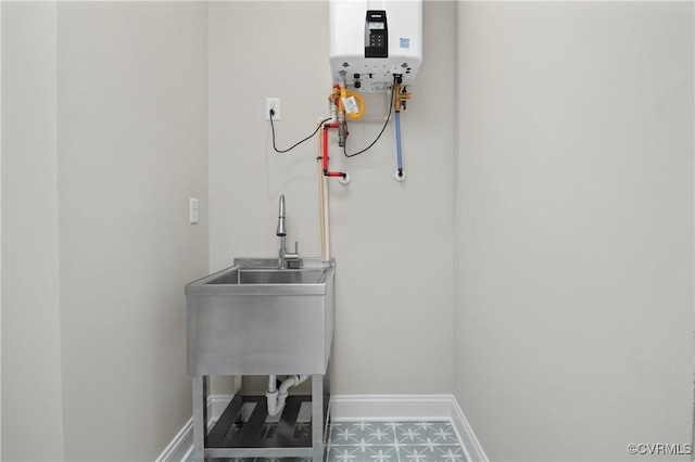 4705 Fitzhugh Ave, Richmond, VA 23230 - utilities with water heater and a sink