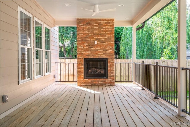 4705 Fitzhugh Ave, Richmond, VA 23230 - wooden deck with an outdoor brick fireplace and a ceiling fan