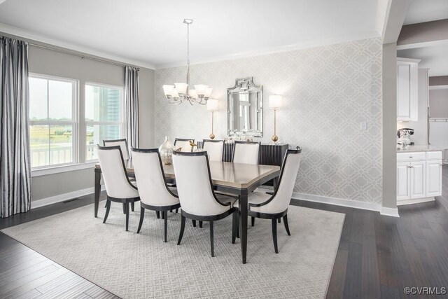 8701 Abercrombie Dr, Chesterfield, VA 23838 - dining area featuring wallpapered walls, a chandelier, dark wood-style floors, and an accent wall