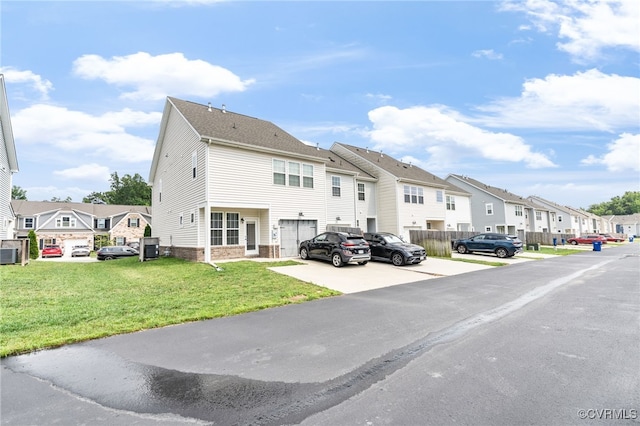 7828 Vermeil St, North Chesterfield, VA 23237 - back of house featuring a residential view and a lawn