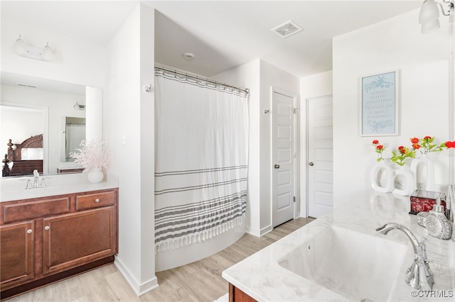 7828 Vermeil St, North Chesterfield, VA 23237 - bathroom featuring vanity, wood finished floors, and curtained shower