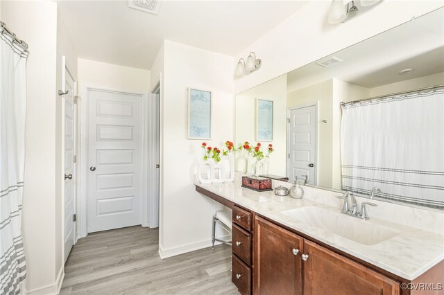 7828 Vermeil St, North Chesterfield, VA 23237 - full bath featuring wood finished floors and vanity