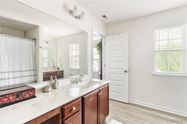 7828 Vermeil St, North Chesterfield, VA 23237 - full bathroom with healthy amount of natural light, wood finished floors, and vanity