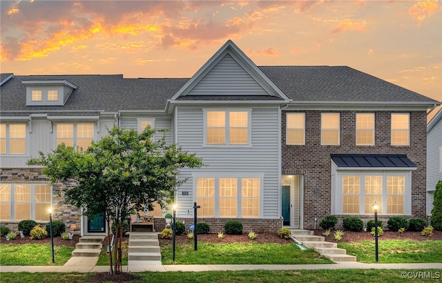 7828 Vermeil St, North Chesterfield, VA 23237 - view of front of property with brick siding, a shingled roof, and a front lawn
