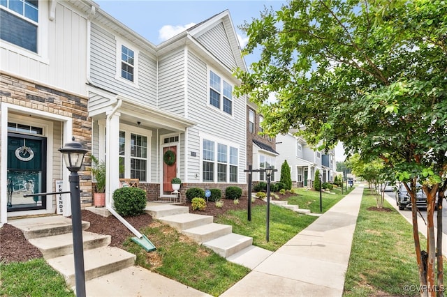 7828 Vermeil St, North Chesterfield, VA 23237 - view of front of home featuring stone siding and a residential view