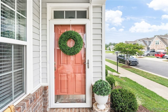 7828 Vermeil St, North Chesterfield, VA 23237 - doorway to property featuring brick siding and covered porch