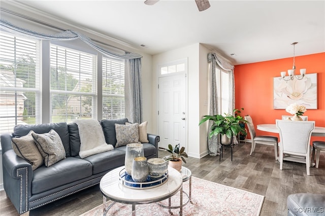 7828 Vermeil St, North Chesterfield, VA 23237 - living room with wood finished floors, a ceiling fan, and a chandelier