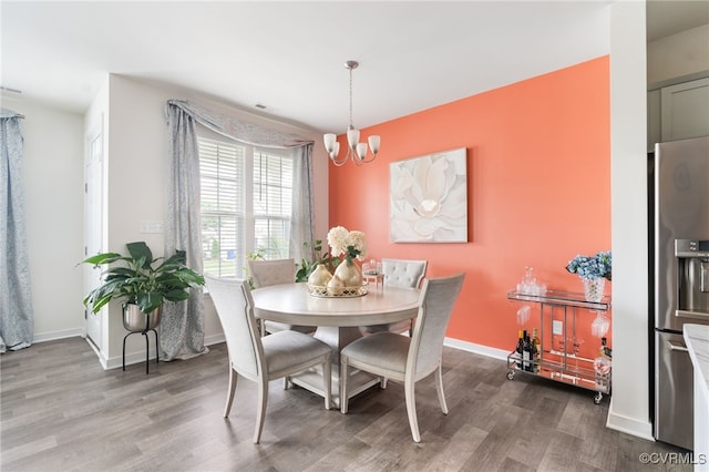 7828 Vermeil St, North Chesterfield, VA 23237 - dining area with a chandelier and wood finished floors