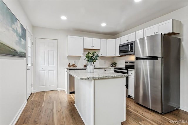 5720 Centerville Rd, Williamsburg, VA 23188 - kitchen with appliances with stainless steel finishes, white cabinetry, light wood-style flooring, and recessed lighting