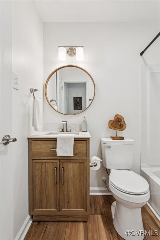 5720 Centerville Rd, Williamsburg, VA 23188 - full bathroom with wood finished floors, vanity, and bathing tub / shower combination