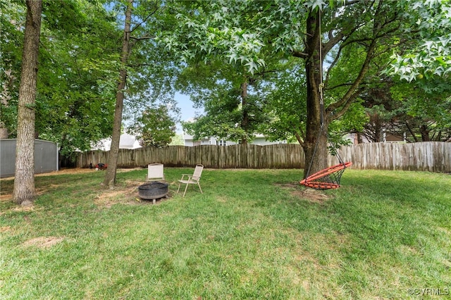 7707 Northern Dancer Ct, Midlothian, VA 23112 - fenced backyard with a fire pit and a shed