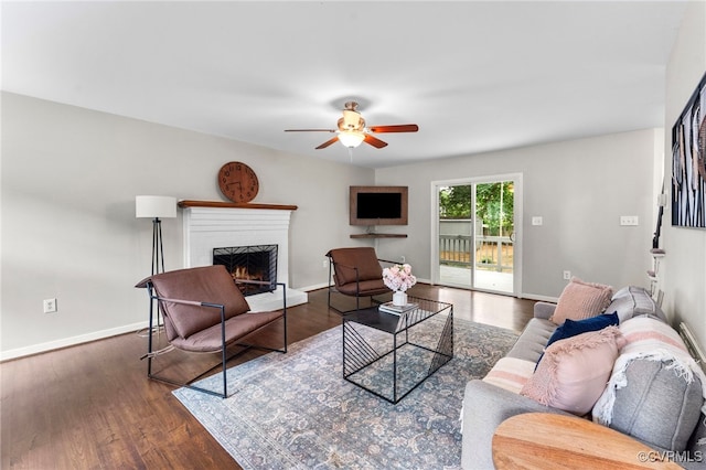7707 Northern Dancer Ct, Midlothian, VA 23112 - living room with ceiling fan, a lit fireplace, and wood finished floors
