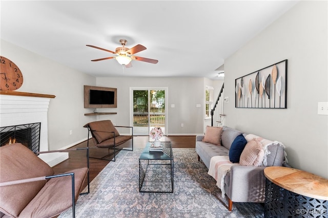 7707 Northern Dancer Ct, Midlothian, VA 23112 - living area with wood finished floors, stairs, ceiling fan, and a brick fireplace