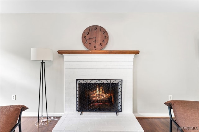 7707 Northern Dancer Ct, Midlothian, VA 23112 - detailed view of a brick fireplace and wood finished floors