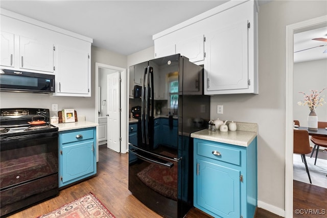 7707 Northern Dancer Ct, Midlothian, VA 23112 - kitchen featuring black appliances, blue cabinetry, dark wood-type flooring, white cabinets, and light countertops